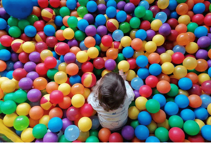 Child playing in ball pit