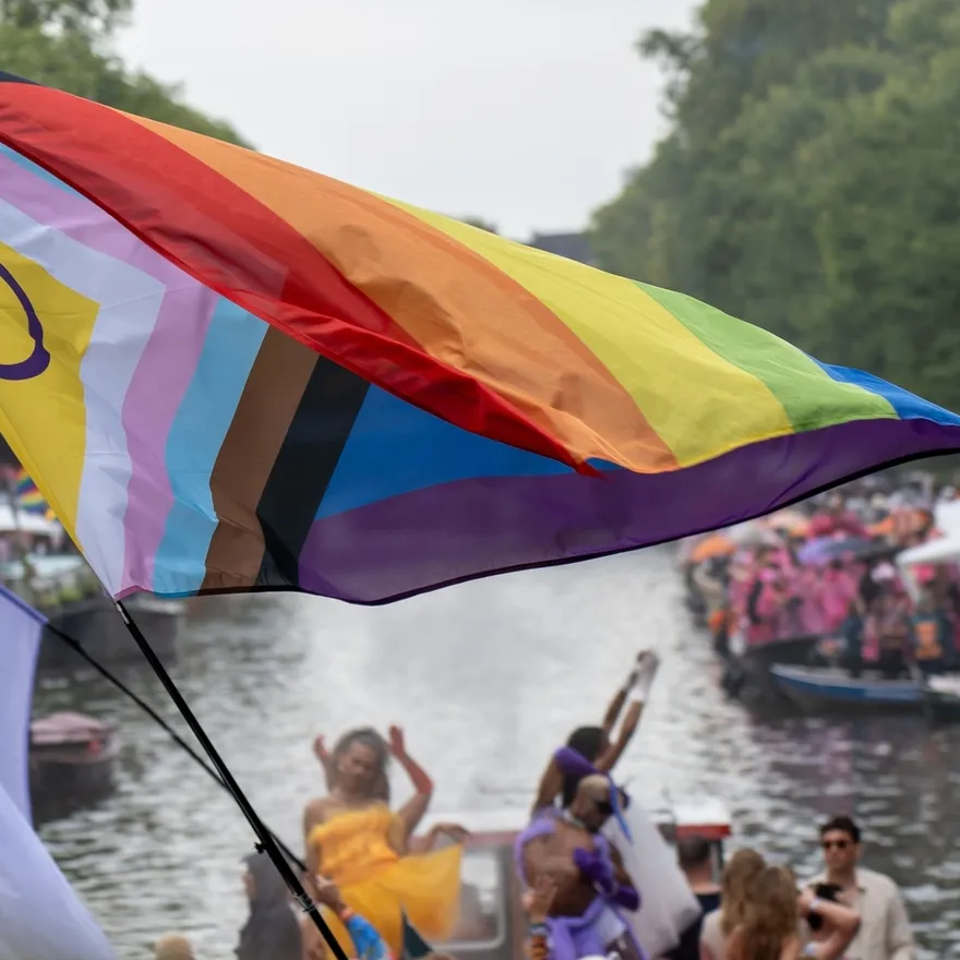 Big rainbow flag during the Canal Parade of Amsterdam Pride 2025.
