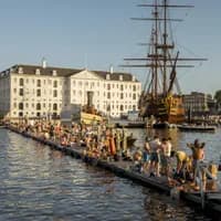 People swimming and sunbathing on the jetty at Marineterrein