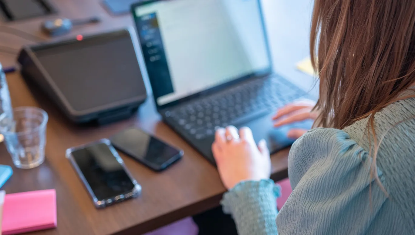 Woman working on her laptop.