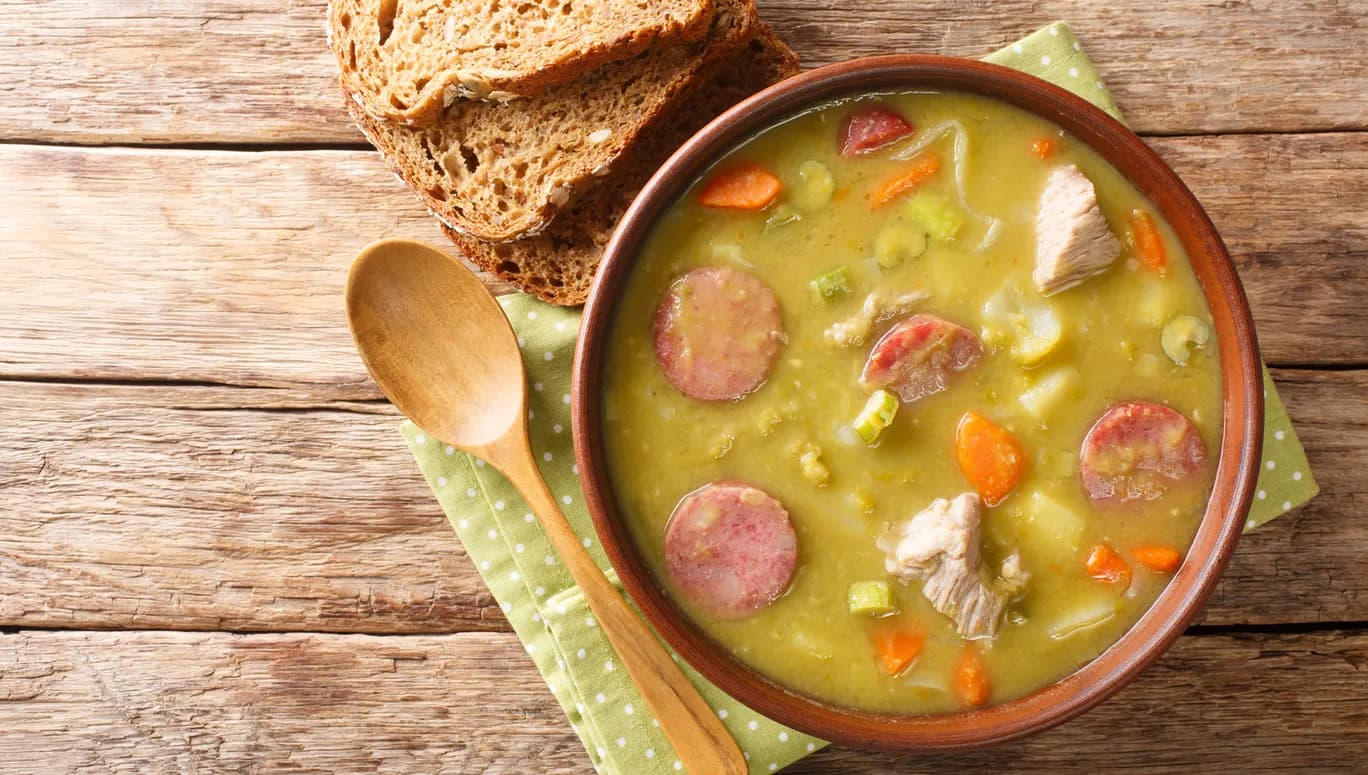 Classic Dutch pea soup erwtensoep, snert closeup in the plate on the table. horizontal top view from above
1873721881
Typically Dutch foods