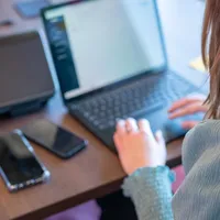 Woman working on her laptop.