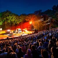 Amsterdamse Bos Theater audience watching a performance at night