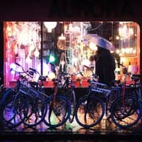 man in rain by bikes