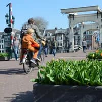 People walking and cycling over the  Magere Bridge