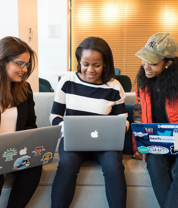 women meeting with computers