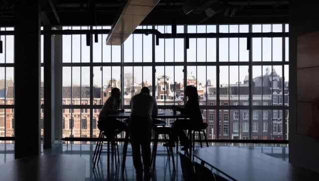 People at table in city centre office