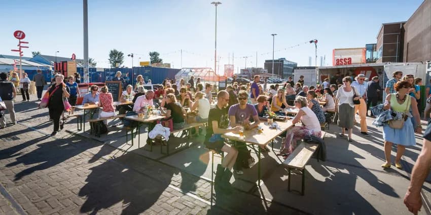 Over het IJ Festival 2019 people sitting in the food area