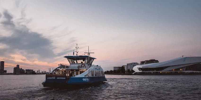 A ferry on its way to Buiksloterweg and EYE Promenade with the Eye Filmmuseum in Noord.
