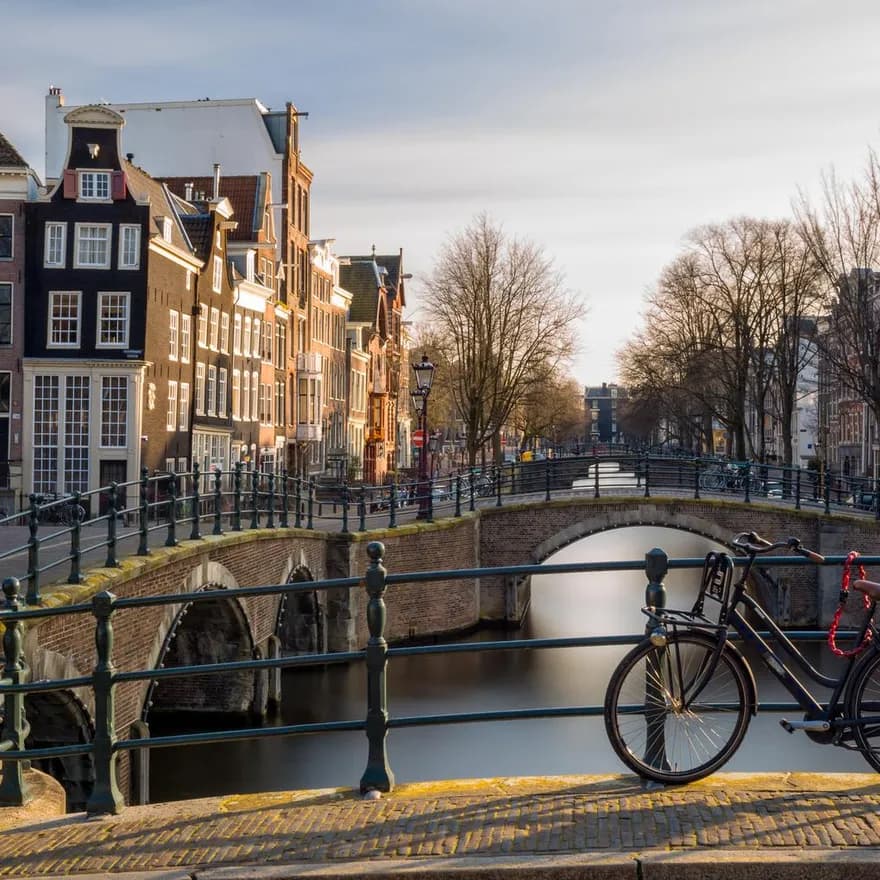 Bike parked on the bridge at Reguliersgracht in Winter