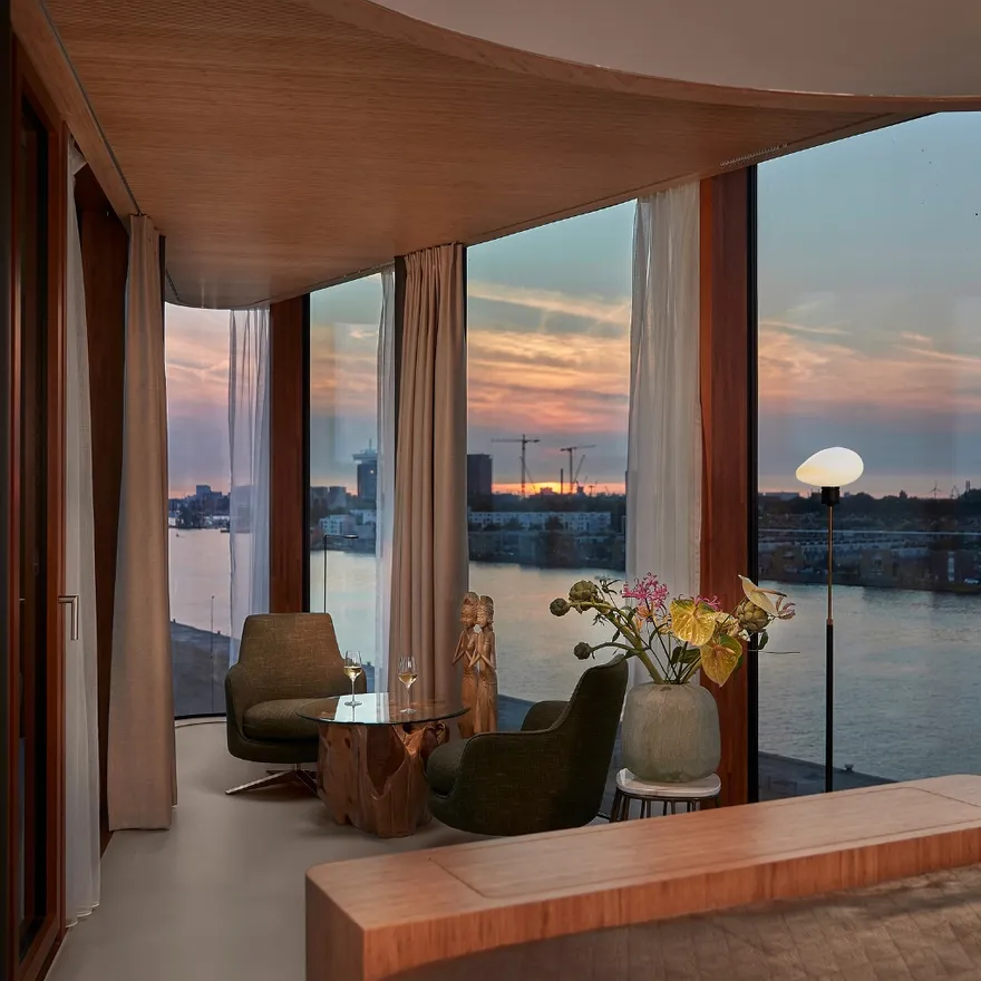 Hotel Jakarta Junior Suite interior and view on 't IJ