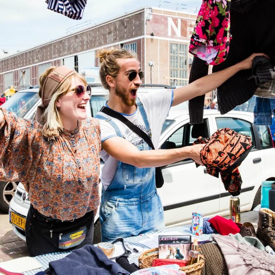 Man and woman selling clothes at IJhallen