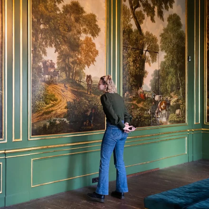 Grachtenmuseum inside, person watching painting