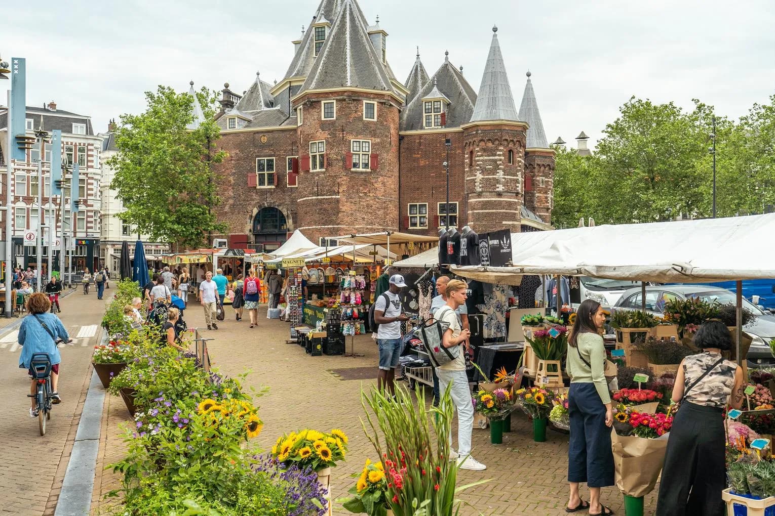 Nieuwmarkt market flower stalls and De Waag