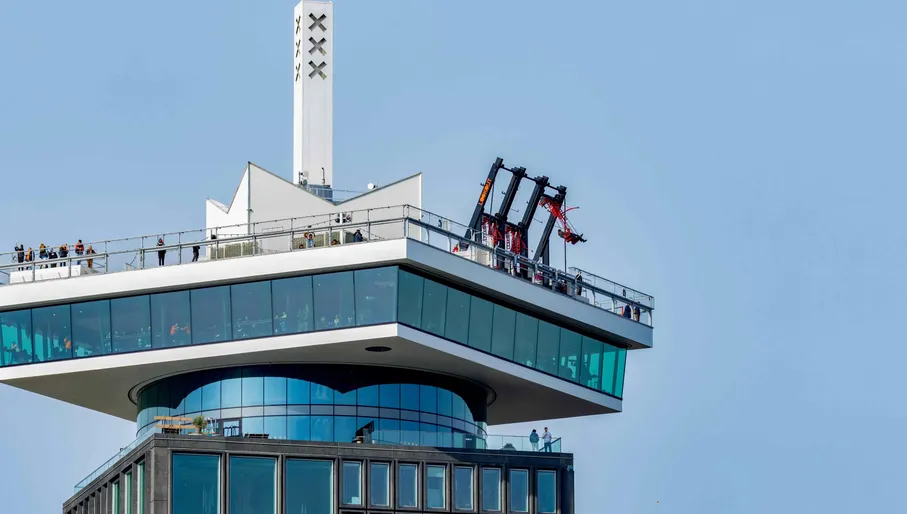 A'dam building in Amsterdam with the lookout tower, revolving restaurant and swim. Dutch attraction for tourism and views in gorgeous sunshine with blue sky