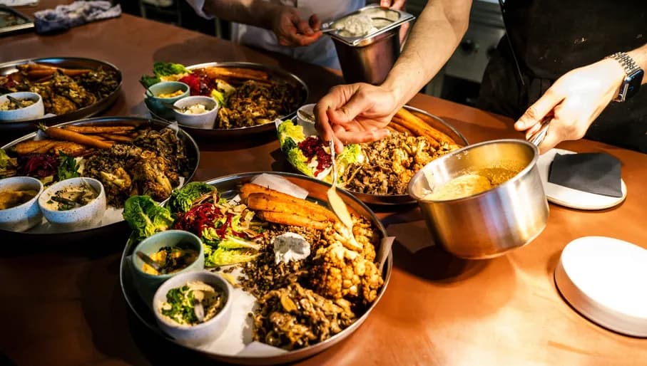 A Beautiful Mess chef preparing plates of food