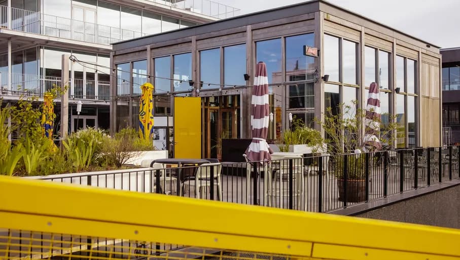 Yellow House exterior with terrace.