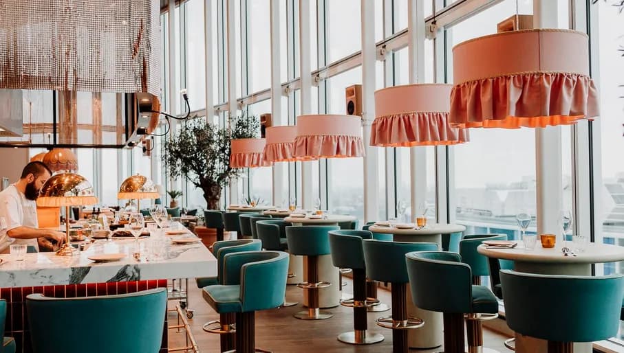Chef preparing dishes at Hasta la Vista, Baby Spanish rooftop skybar restaurant in Zuidas