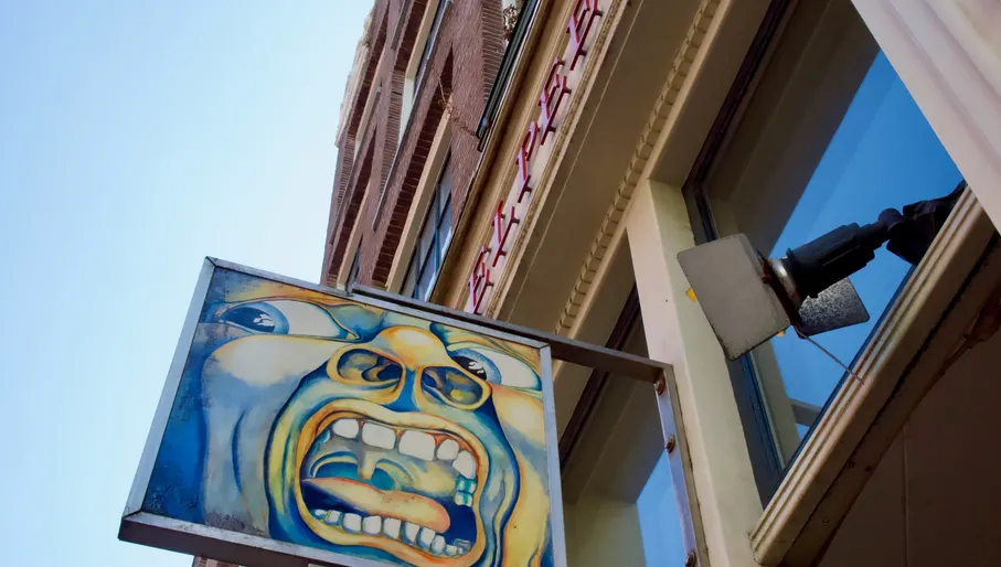 Outside of the shop, inside vinyls, owner of the shop, people looking at vinyls