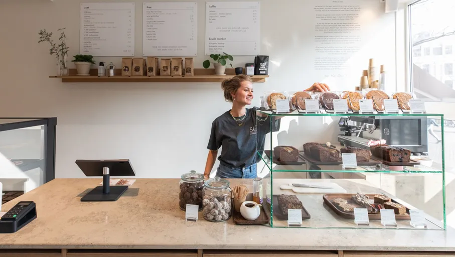 SUE bites bar employee behind the counter