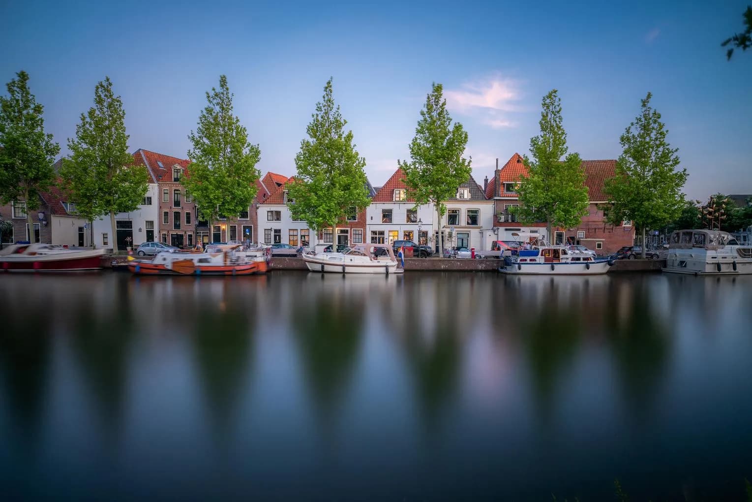 Treeline canal with docked boats - internal use royalty free, external use editorial only