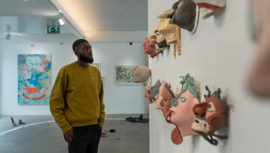 A man visit an exhibition of CBK Zuidoost.