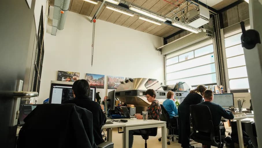 People working on computers at the Roboat Amsterdam office