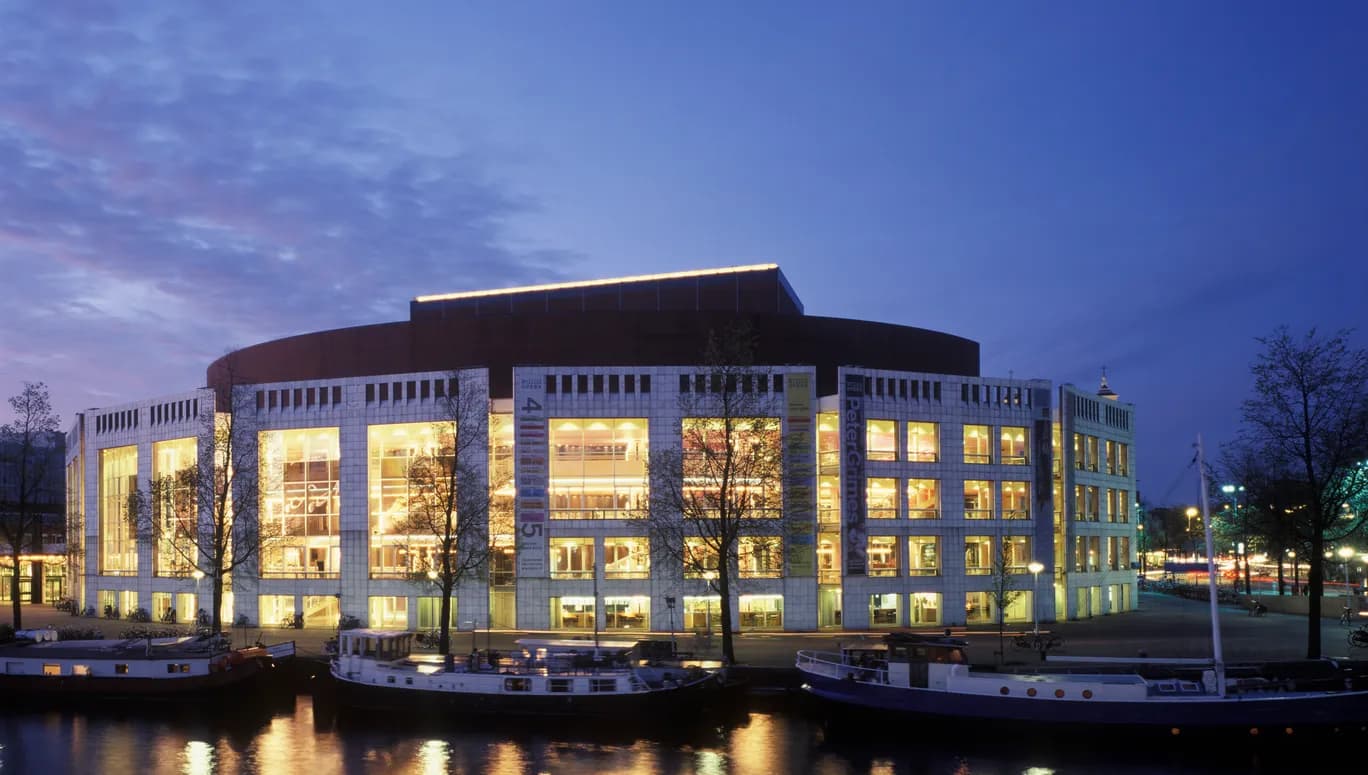Stopera near Waterlooplein from the otherside of the river by night
