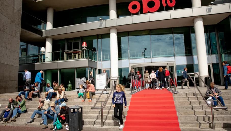 people sitting outside OBA public library
people walking in and out of OBA