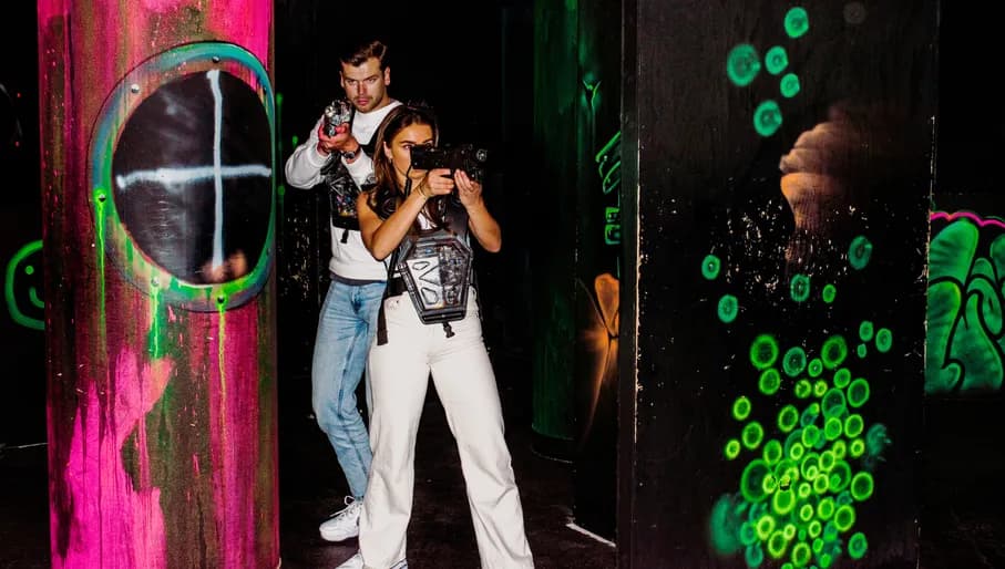 Aloha game center, people playing laser tag