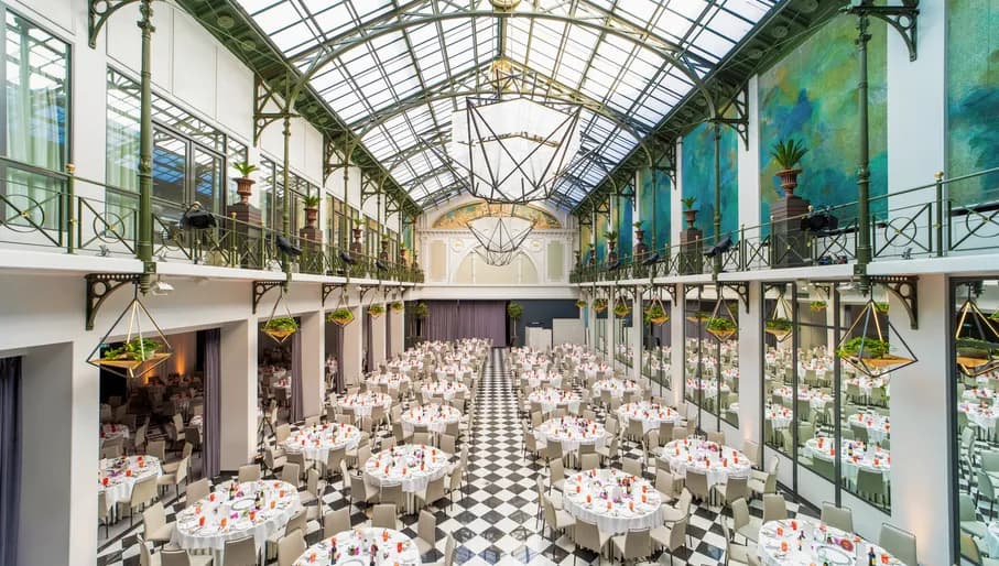 Wintergarden meeting room with banquet setting at Anantara Grand Hotel Krasnapolsky.