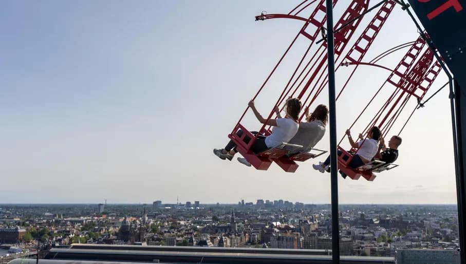 People on the / ADAM Lookout / swings