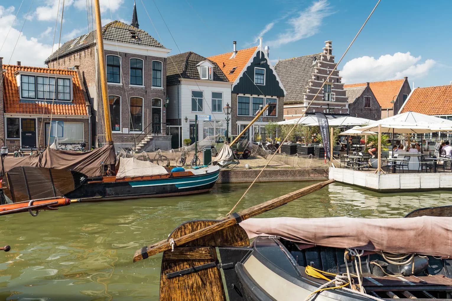 Fischers boat in the canal in the city of Monnickendam.