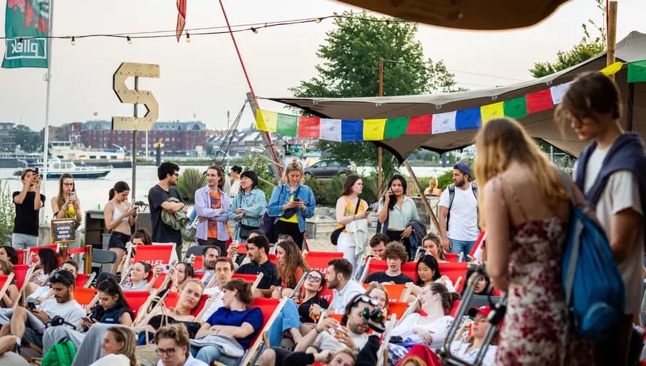 People lounging on beach chairs at Plekk