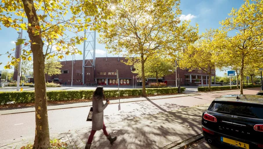 A person walks past the Olymic Stadium of Amsterdam.